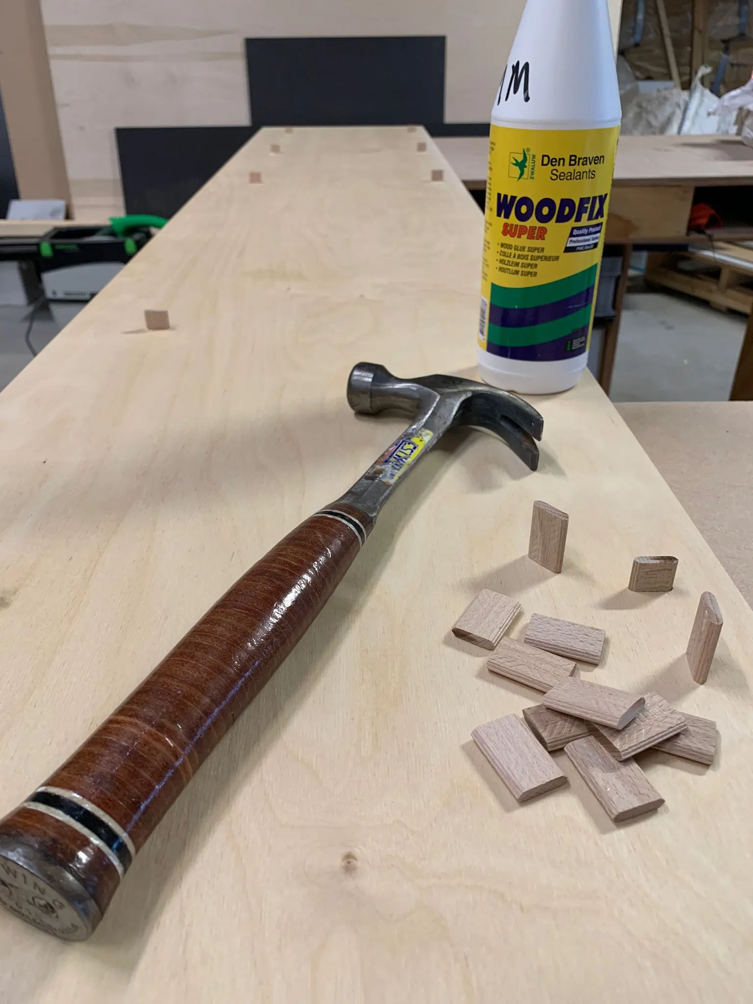 Estwing hammer and dominos being hammered and glued into joints.